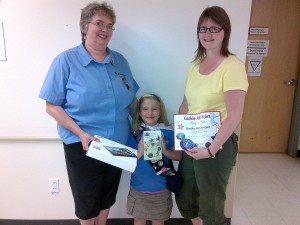 Kim Lebel and Sheri Linton-Jamer awarding Brooke with the Girl Guide All Star plaque & new Tablet