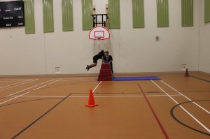 Casey Sappier vaults as she runs through the RCMP PARE Course. Casey clocked the fastest time of all the participants!