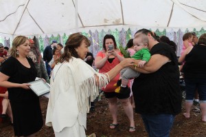Imelda Perley welcomes a new baby into the community in a traditional ceremony  Oluwikoneyak Weckuwapasihtit is 7th Generation, from the womb to beyond