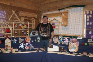 Doug McKinley displays some of his family’s hand crafted art works at the World Pond Hockey Welcome Centre in Plaster Rock