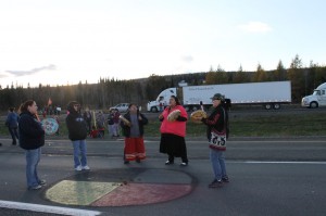 Women Drummers from TFN drum and sing around a Medicine   Circle on the TransCanada Highway on Thursday