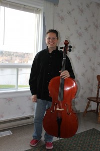 Emmanuel with a borrowed cello….