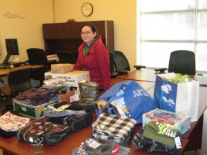 Shelly Snow with some of the Christmas Cheer  gifts that were donated last year