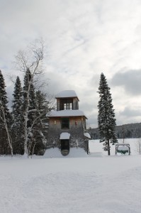 Randy Hathaway built this nifty 3 storey working lighthouse on the Tobique in 2005 using recycled vintage doors, windows and wood.