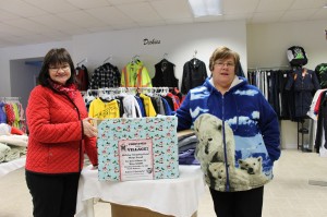 Cindy McLaughlin holds the box at The Look-One Stop as  Rose Morrissey draws the winning ticket in the  PABC $500 Christmas Give-Away