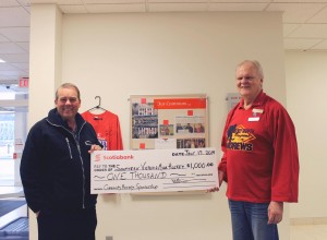 SV Minor Hockey President Andy Savoy smiles as he  accepts a cheque  to support the cause from Scotiabank branch manager Mike Allen 