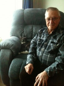 Petey hogs the big, comfy  chair…. but Victoria Villa resident Everett O’Neil doesn’t mind!