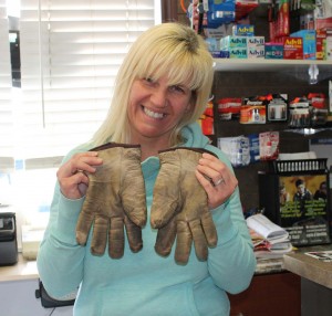 Shelly at Squeaky’s Convenience Store holds a lonely pair of work gloves that are missing their person