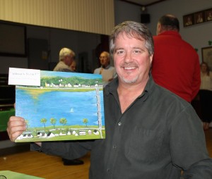 Joe McPhail proudly displays his prize …. A painting by Maj Gagnon he purchased at the  Silent Auction