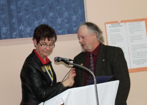 Rotarian Pat Perry pins the Paul Harris Award on Rod MacIntosh