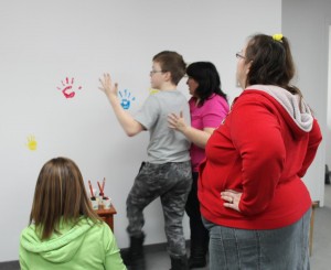 A wall for the kids to leave their hand print on makes the new centre their very own!