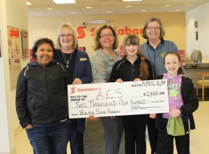 From left to right: Kira Wilson, Wanda Mayo, Tasha Turner, Allie McFadden, Andover Elementary Principal Ann Marie Berry Wattie and Allyson Dickson with the Big Cheque for playground equipment