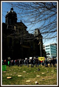 A simulated clear cut on the front lawn of the NB Legislature building during the rally Joe Gee photo