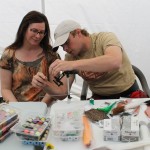 Lachlan MacIntosh helps Maureen as she ties a beautiful Woulff Fly at the fly tying clinic