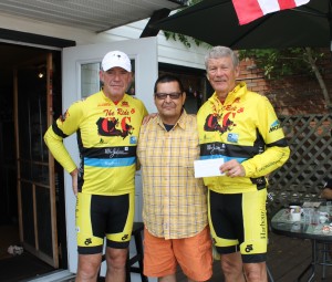 Hugh Fallon, Tim Nicholas & Sid Dickinson with a donation Tim & his  family presented to  the C2C bikers while enjoying lunch at the 878 Bistro 